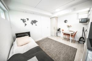 Spot Apartments Helsinkiにあるベッド