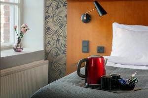 Postel nebo postele na pokoji v ubytování Hotel Lasaretti