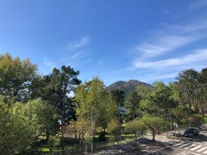 a view of a mountain from a parking lot at Pension Antonio in Louro +20 photos