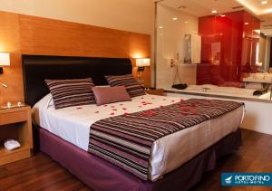 Uma cama ou camas num quarto em Motel Portofino