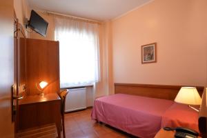 Cama o camas de una habitación en Hotel Siena