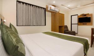 Postel nebo postele na pokoji v ubytování Hotel Residency Park