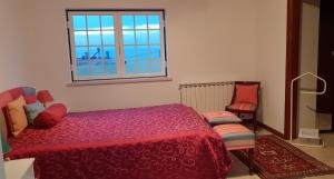 Postel nebo postele na pokoji v ubytování Casa Harmonica com vista mar