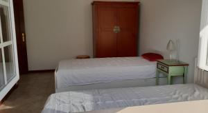 Postel nebo postele na pokoji v ubytování Casa Harmonica com vista mar