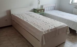 Postel nebo postele na pokoji v ubytování Casa Harmonica com vista mar