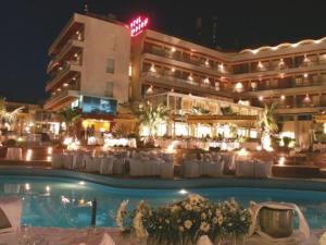 a hotel with a pool in front of a building at Philippion in Thessaloniki