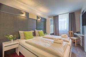 Postel nebo postele na pokoji v ubytování Hotel Residenz23 + 37 fotografií