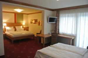 Postel nebo postele na pokoji v ubytování Hotel Jägerhof