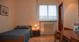 A bed or beds in a room at Hotel A-14