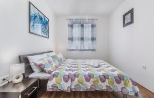 a small bedroom with a bed and a desk at Apartments Kimi in Rovinj +67 photos