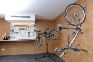 a bike hanging on a wall in a room at Nura Santa Ponsa & Spa in Santa Ponsa