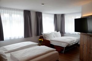 Postel nebo postele na pokoji v ubytování Am Zehntstadl Hotel & Sauna