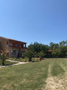 a view of a house with a large yard at Sunrise in Campomarino