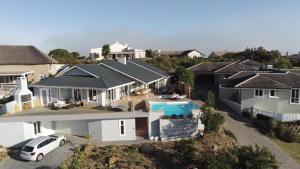 an aerial view of a house with a swimming pool at CM34 - Pezula Heaven On Earth in Knysna