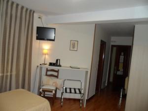 TV a/nebo společenská místnost v ubytování Hostal Coruña