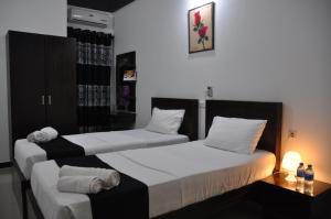 Säng eller sängar i ett rum på Hotel Agape
