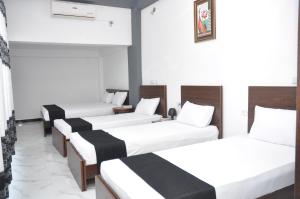 Postel nebo postele na pokoji v ubytování Hotel Agape