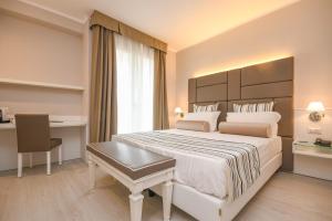Posteľ alebo postele v izbe v ubytovaní Hotel Oliveto