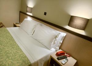Postel nebo postele na pokoji v ubytování Hotel Conchiglia