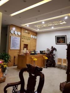 a room with a hair salon with a statue in it at Minh Manh Hotel in Pleiku +27 photos