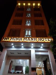 a hotel sign on the front of a building at Minh Manh Hotel in Pleiku
