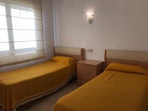 A bed or beds in a room at President A-9