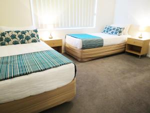 Säng eller sängar i ett rum på Nesuto Newhaven