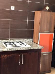 a kitchen with a stove and a counter top at Oued Laou Sea View واد لاو in Oued Laou +16 photos