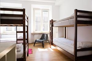 Posteľ alebo postele v izbe v ubytovaní Folk Hostel