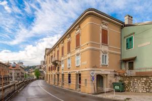 a building on the side of a street at Adeona apartments in Rijeka