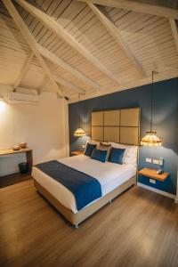 Postel nebo postele na pokoji v ubytování Hotel Boutique El Triángulo