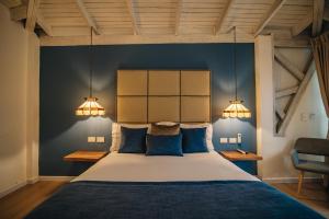 Ένα ή περισσότερα κρεβάτια σε δωμάτιο στο Hotel Boutique El Triángulo