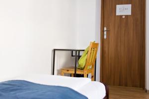 Posteľ alebo postele v izbe v ubytovaní Folk Hostel