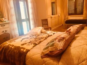 Ein Bett oder Betten in einem Zimmer der Unterkunft Monna Lisa B&B