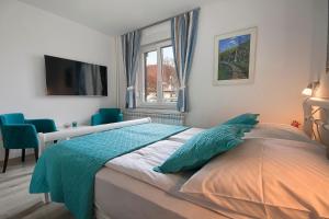 Posteľ alebo postele v izbe v ubytovaní Emerald Luxury Apartments