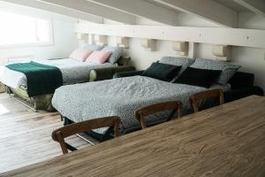 En eller flere senger på et rom på Attico 72