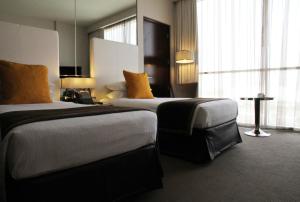 Postel nebo postele na pokoji v ubytování Centro Yas Island-by Rotana