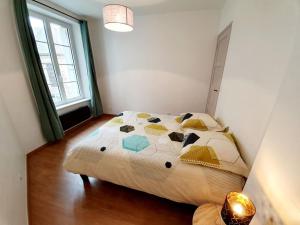 Un pat sau paturi într-o cameră la Le Pilo