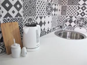 a kitchen counter with a toaster and a sink at SeaEye Trogir in Trogir +36 photos