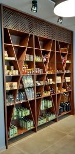 a large pantry with wooden shelves in a room at Platanos Rooms in Anopoli Sfakion