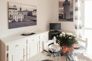 Televízia a/alebo spoločenská miestnosť v ubytovaní Appartamenti Sole