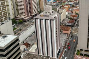 an aerial view of a tall building in a city at Roochelle Hotel by Nobile in Curitiba