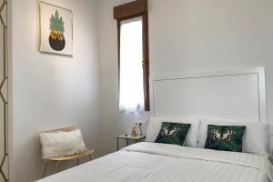 Posteľ alebo postele v izbe v ubytovaní SUITES CASA LUBÉN