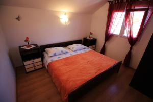Postel nebo postele na pokoji v ubytování Apartmani Marino