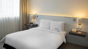 Postel nebo postele na pokoji v ubytování Sol de Oro Hotel & Suites