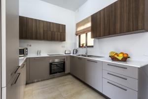 Cucina o angolo cottura di Sunny Modern Apartments