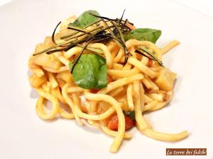 a white plate topped with noodles and vegetables at Hotel Caserta Antica in Caserta