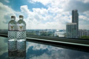 two bottles of water sitting on a window sill at V Hotel Lavender in Singapore