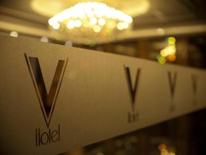 a hotel sign in a store window at V Hotel Lavender in Singapore