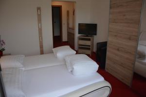 Postel nebo postele na pokoji v ubytování Hotel Böhmerwaldhof